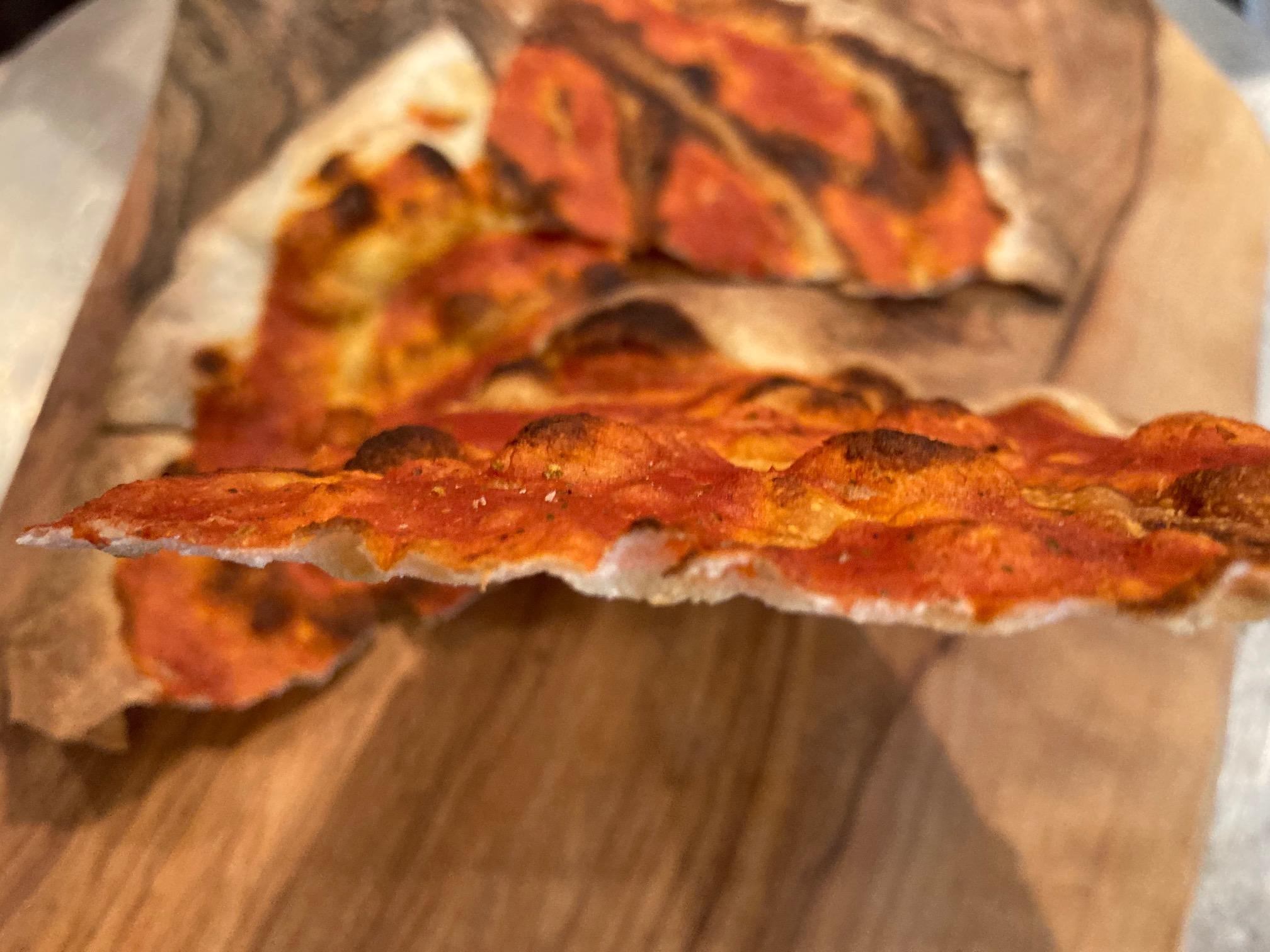 Pizza wafer-thin and crispy